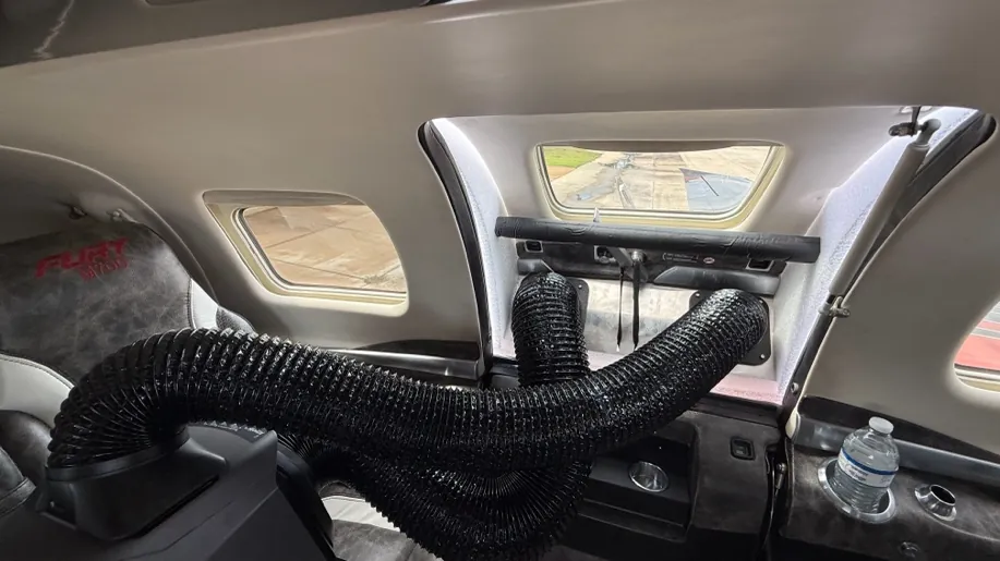 Inside setup: the Wave 3 in the cabin with both hoses connected to the plenum from inside.
